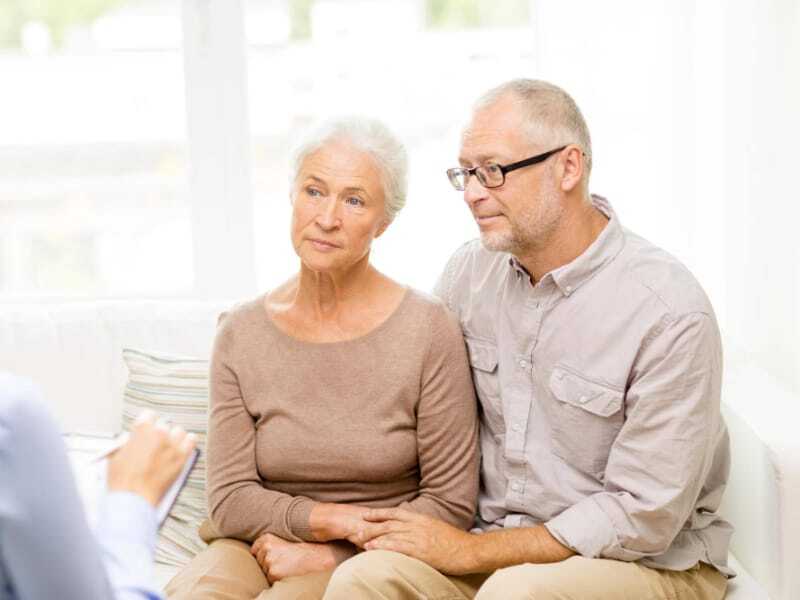 senior couple listening to advisor