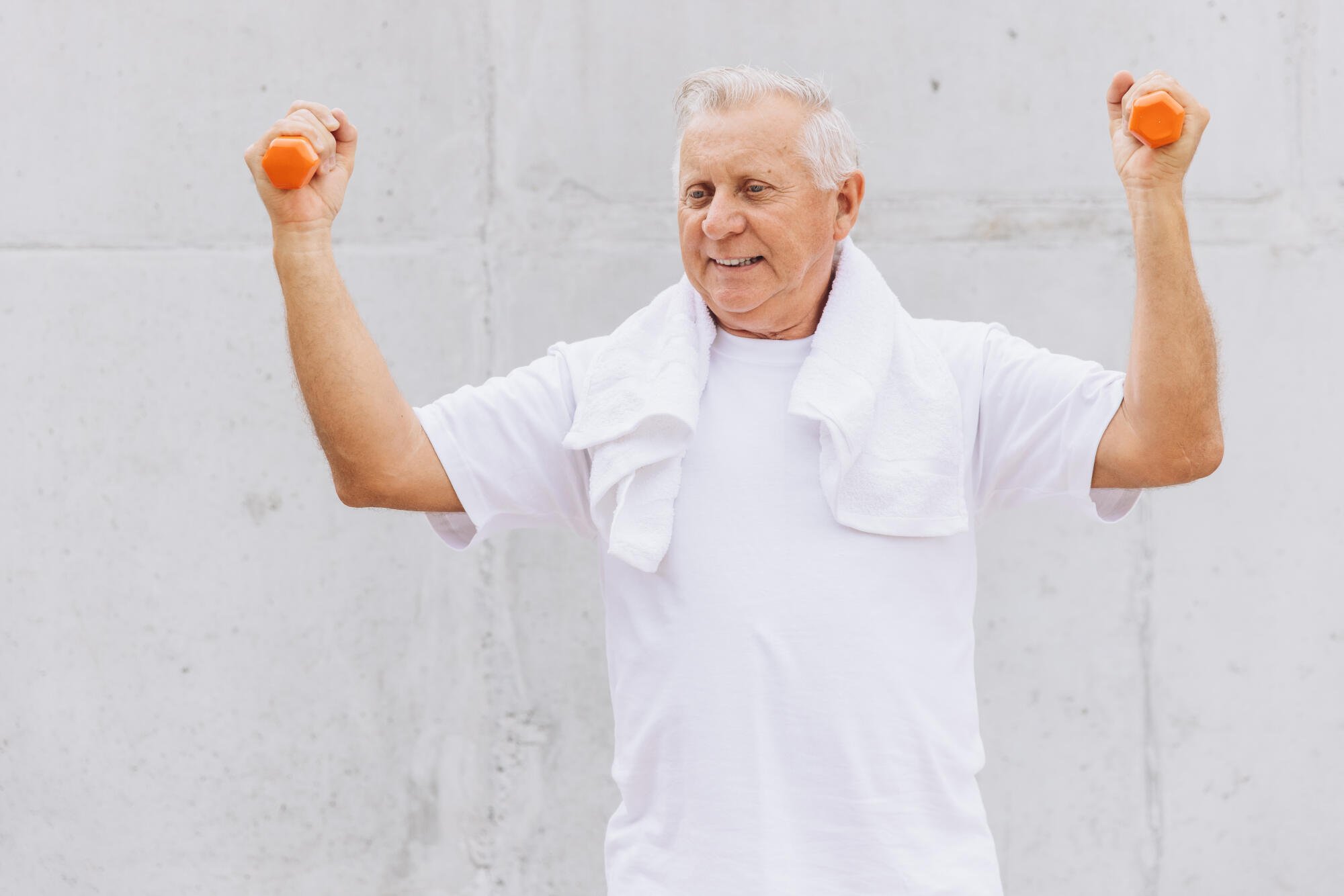 Senior-Man-Exercising-with-Dum-4